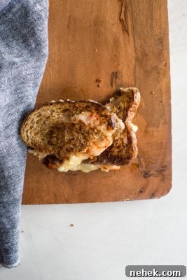 Shrimp Grilled Cheese: melted cheddar, buttered toast, and large grilled shrimp.