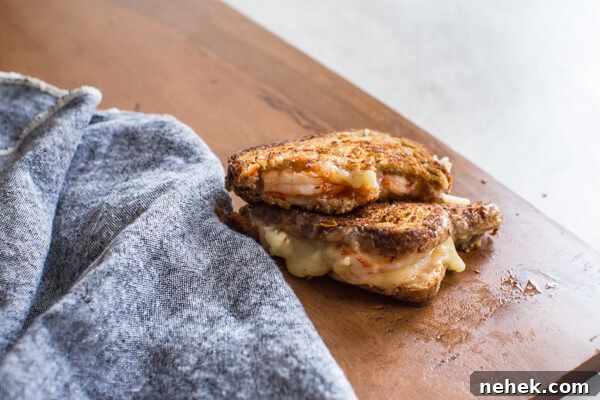 Shrimp Grilled Cheese: melted cheddar, buttered toast, and large grilled shrimp.