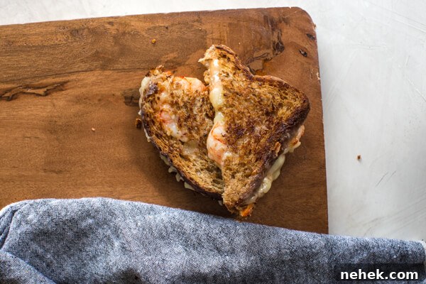 Shrimp Grilled Cheese: melted cheddar, buttered toast, and large grilled shrimp.