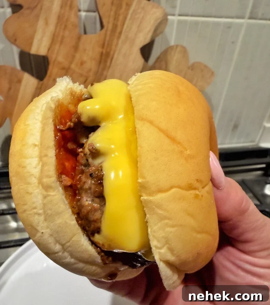 A close up of a finished burger