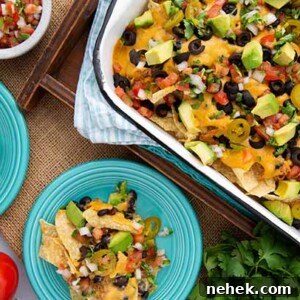 Vegan Jackfruit Nachos in a baking dish and on blue serving plates