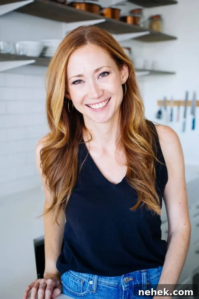 Tessa in her white kitchen.