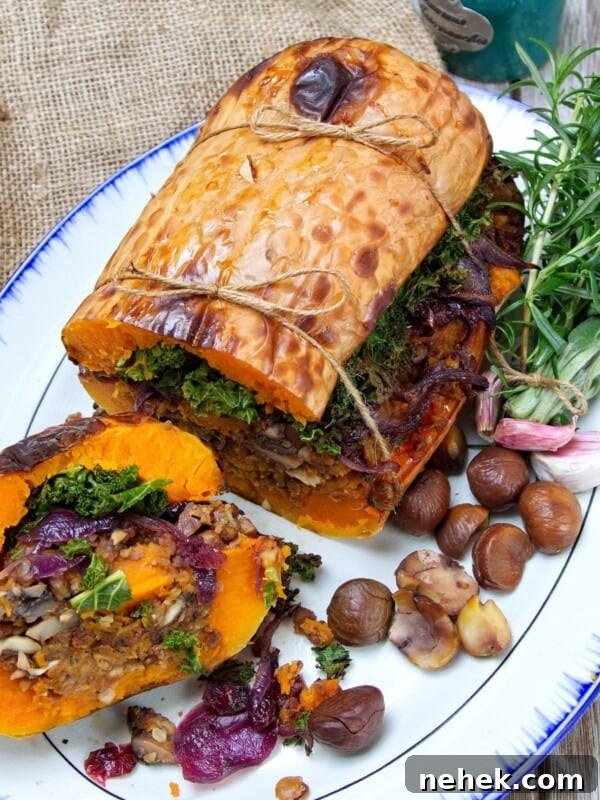 stuffed butternut squash on a white plate, sliced open