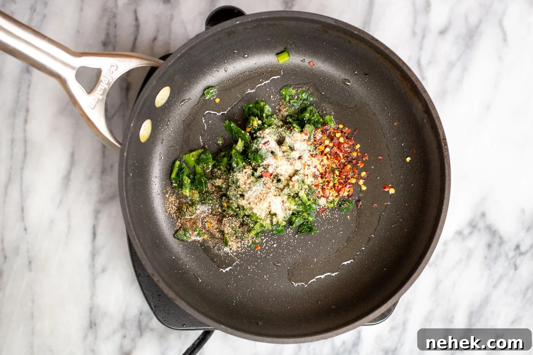 Vegan Moong Egg Sandwich Recipe: Protein-Packed Plant-Based Breakfast 7 spinach, garlic and chili pepper in a black sauteeing pan