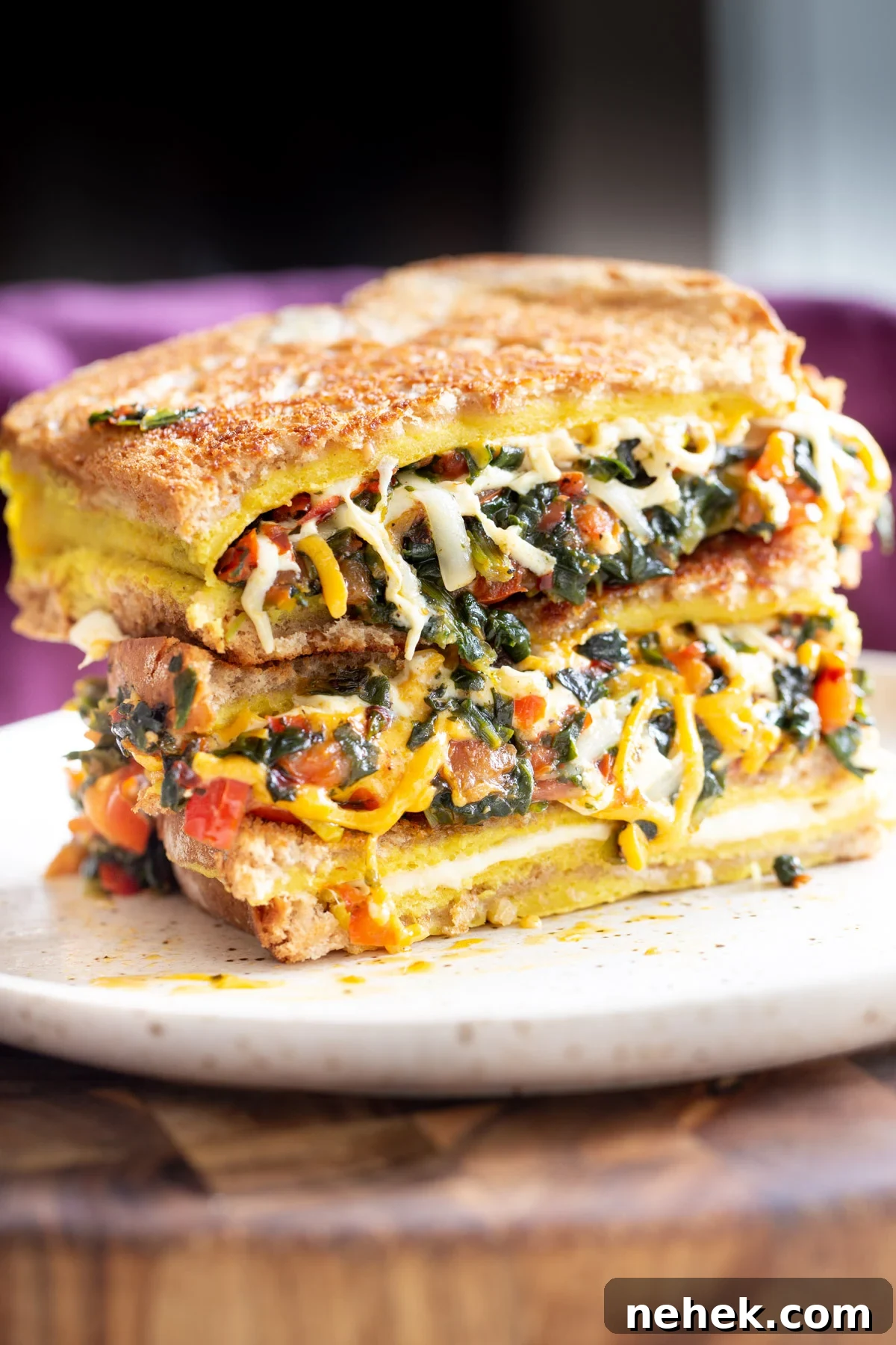 Vegan Moong Egg Sandwich Recipe: Protein-Packed Plant-Based Breakfast 4 stacked vegan moong egg sandwich on a plate