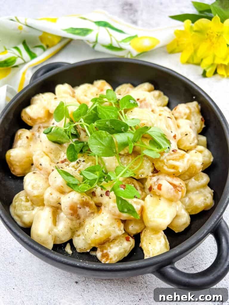 Lemon Parmesan Gnocchi with Creamy Citrus Sauce 10 Gnocchi with Lemon Parmesan Sauce in a black serving dish.