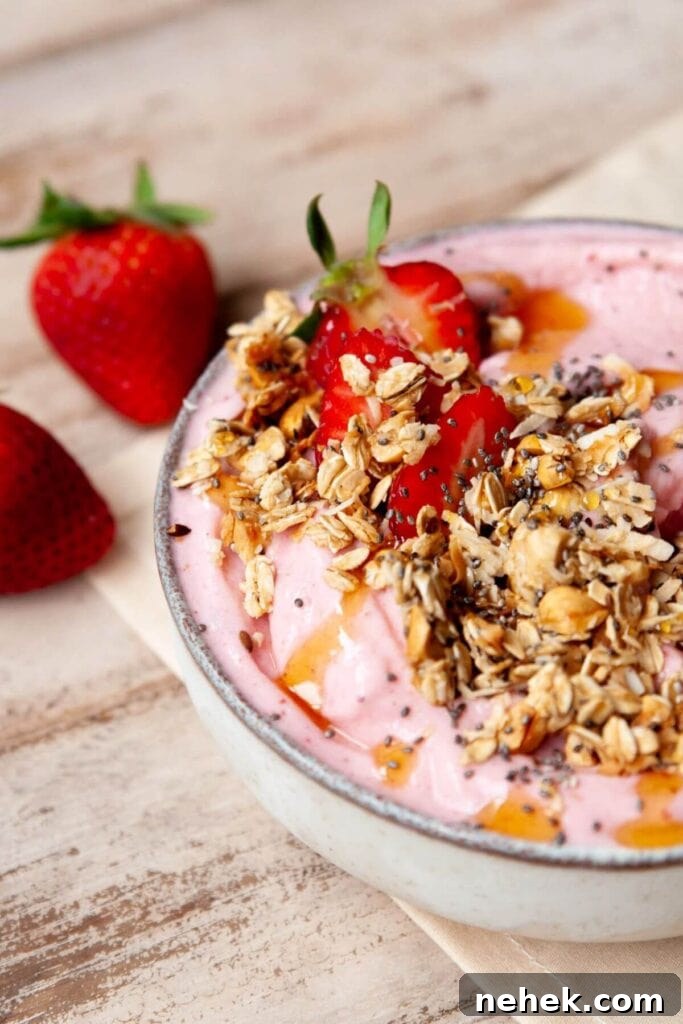 Creamy Strawberry Smoothie Bowl Recipe with Fresh Toppings 7 Thick Greek yogurt strawberry smoothie bowl topped with fresh fruit and granola
