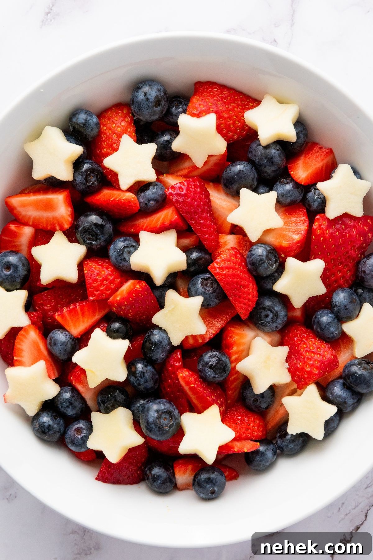 Top down view of a bowl of patriotic fruit salad.