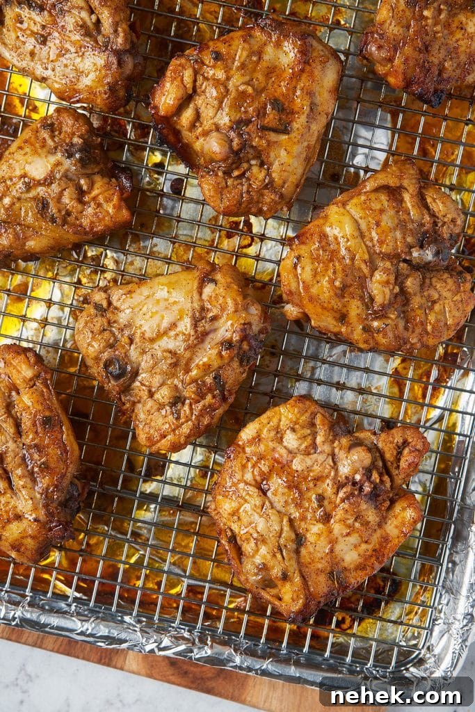 Golden brown roasted pollo asado on a wire rack