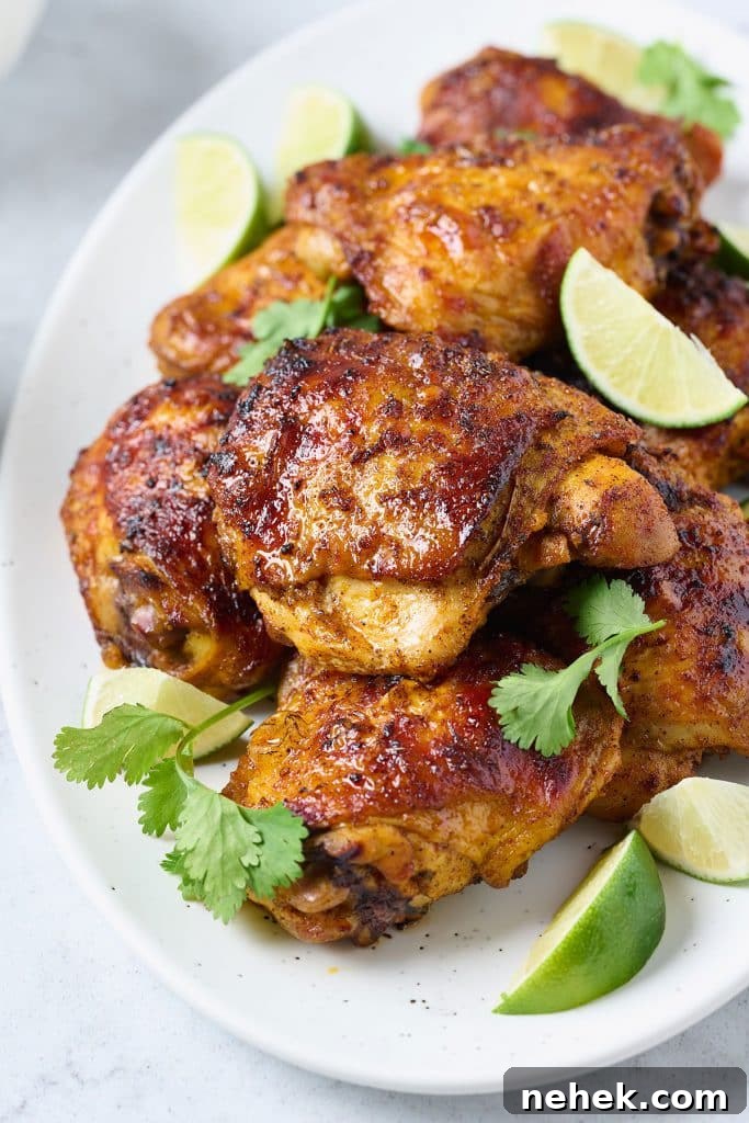 Pollo asado pieces served on a white plate