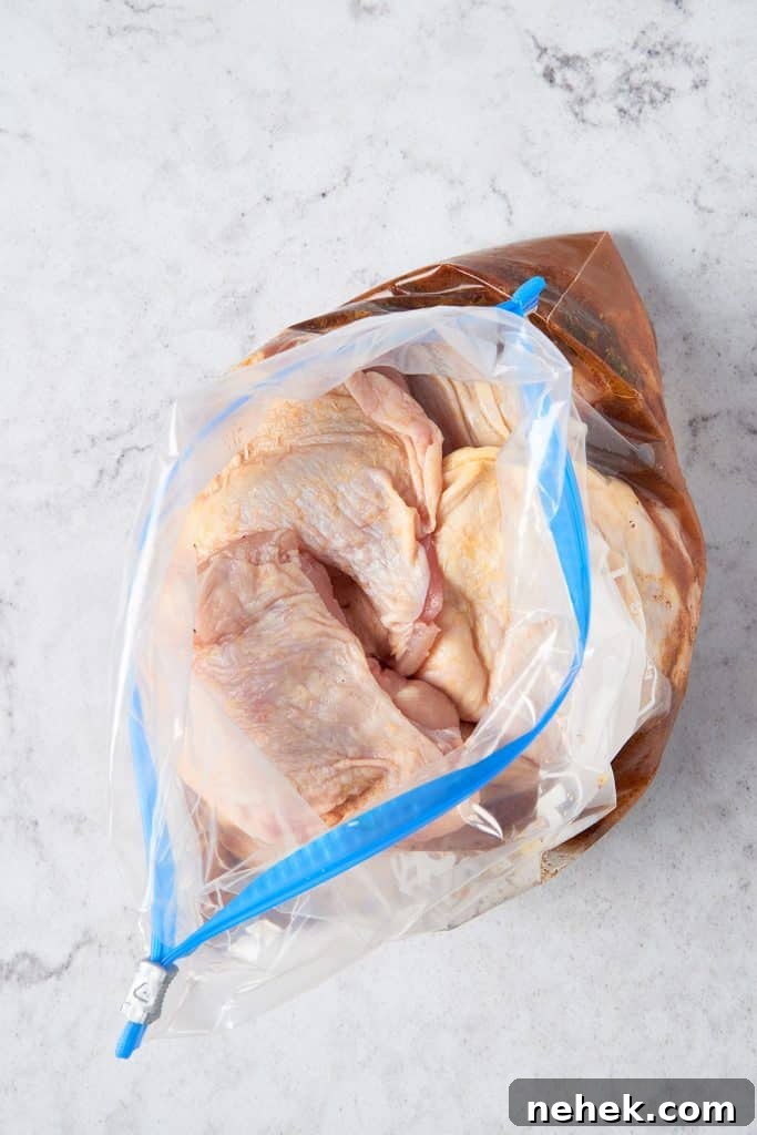 Adding chicken into a marinade