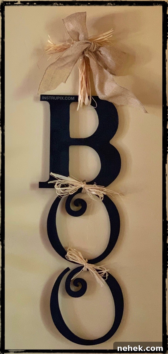 Looking for easy DIY Halloween decoration ideas? This easy Boo sign is super fun to hang on your front door or by your entryway. It's great for inside or outside, hang it wherever you want! This homemade Halloween decor is simple, cheap and fun to make!