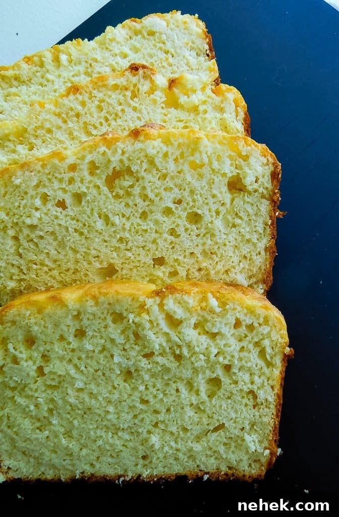 slices of low carb bread on a black cutting board