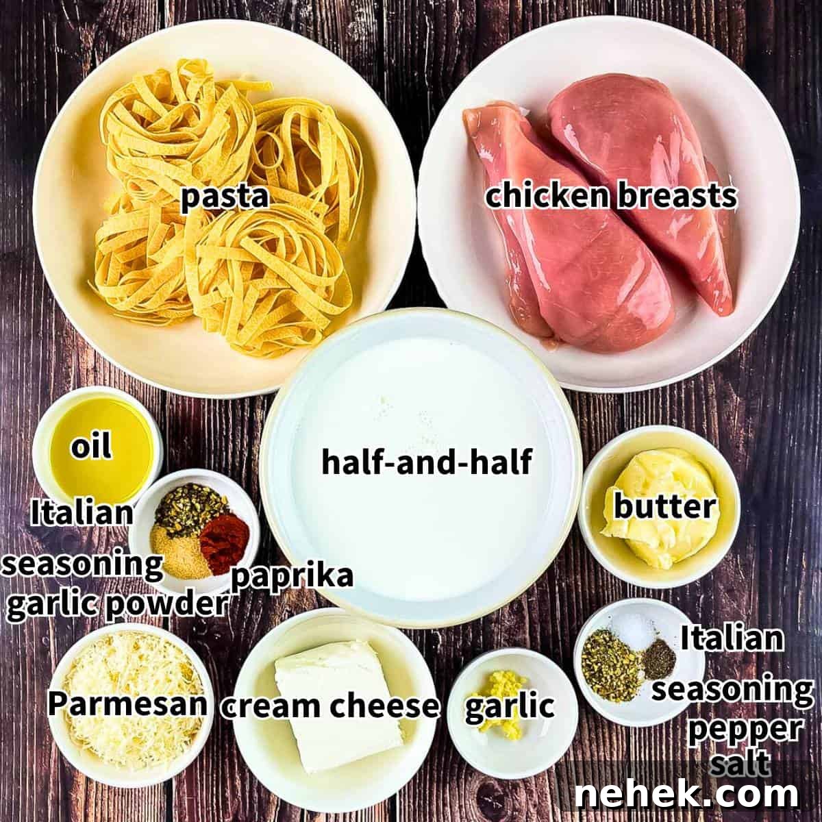 The ingredients for air fryer chicken alfredo measured out and placed on a wooden table.