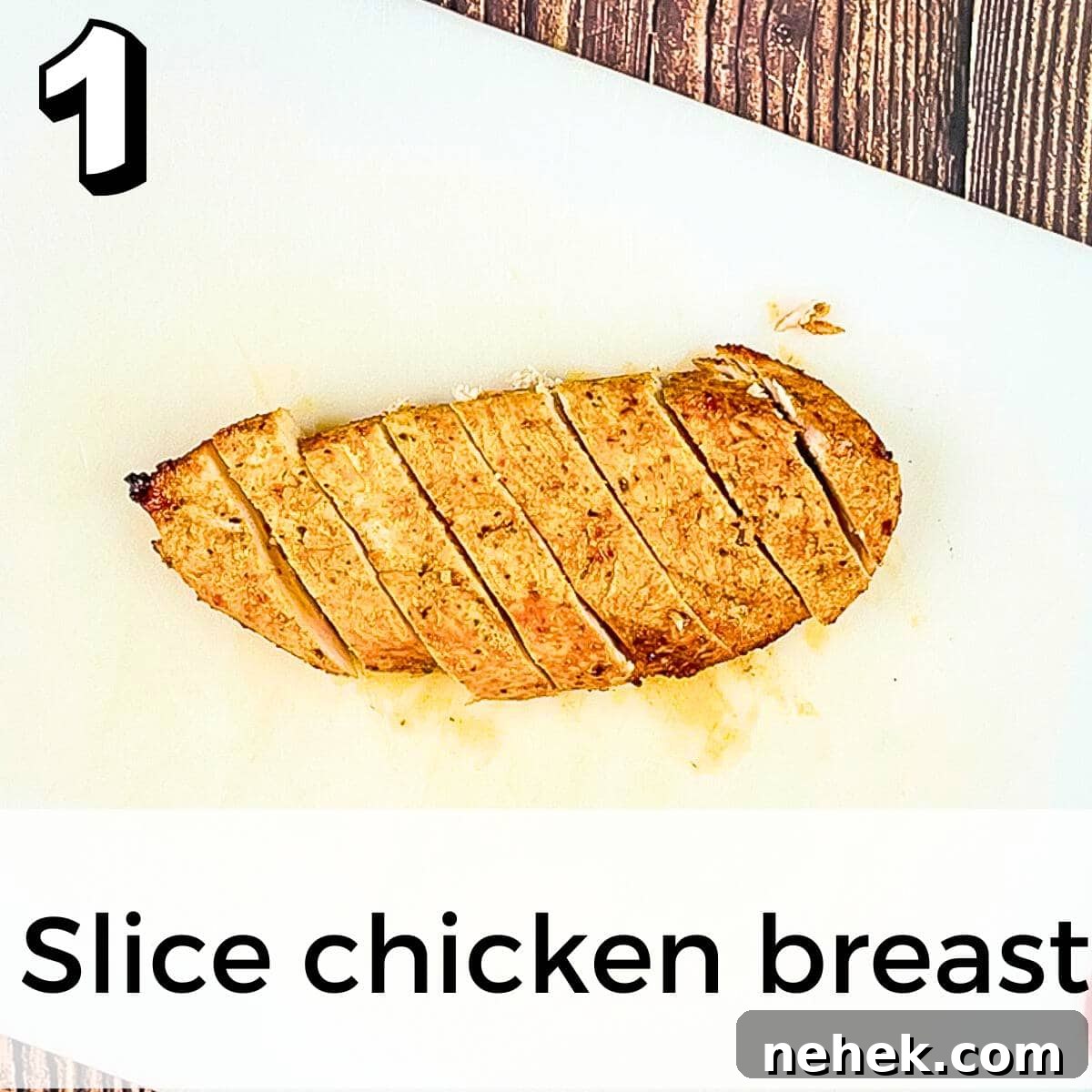 The cooked chicken breast sliced into thin strips.