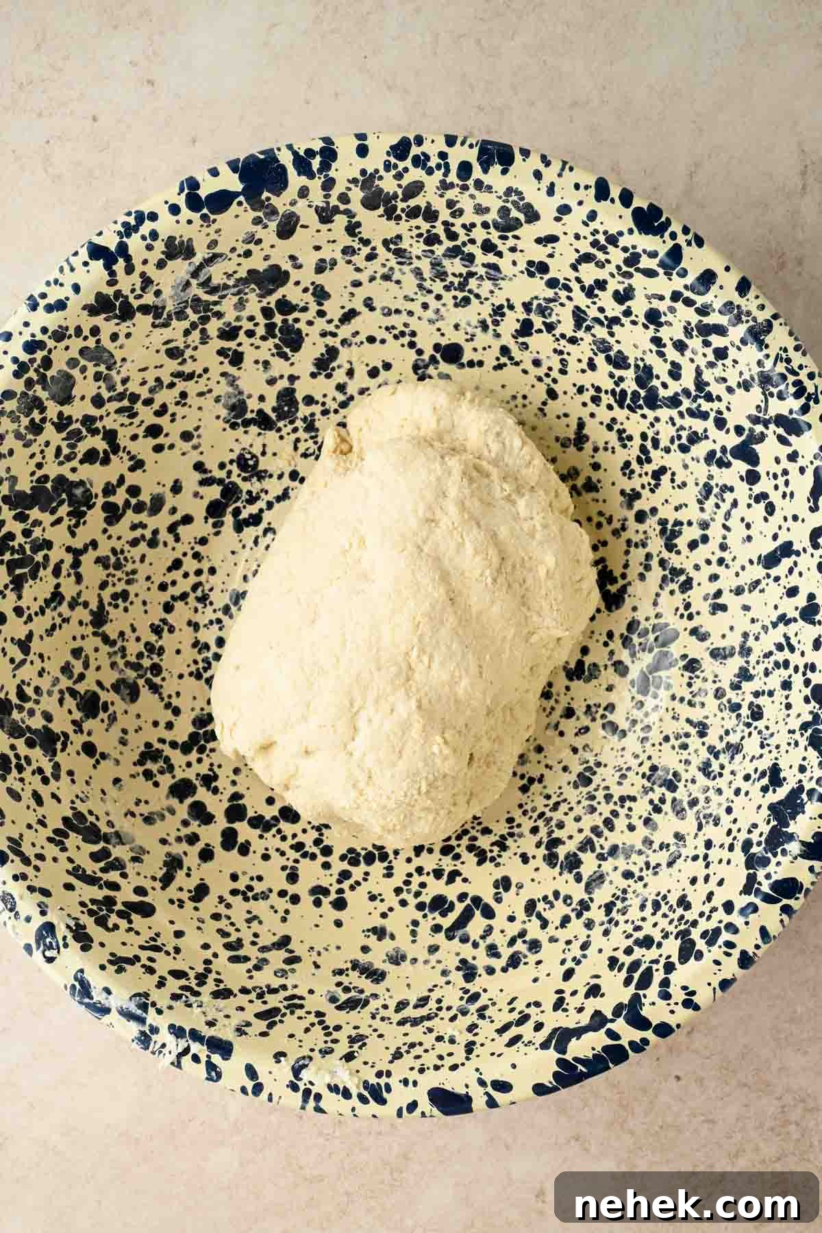 cottage cheese based bread formed into a ball in a bowl.