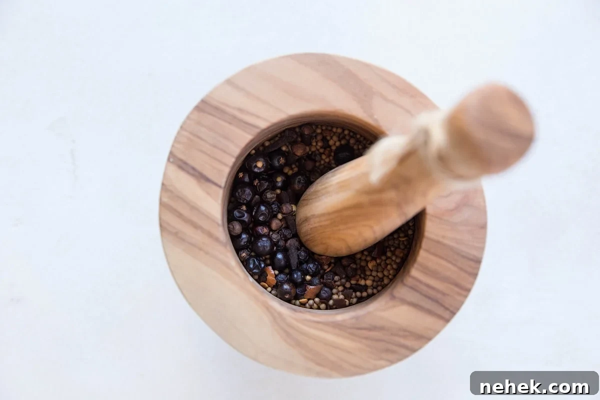 Nitrate-Free Paleo Pastrami: Homemade Recipe and Tips 8 Mortar and pestle crushing spices for pickling