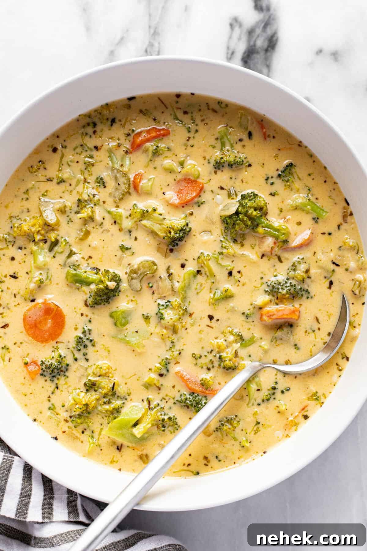 Creamy Instant Pot Broccoli Cheddar Soup Recipe 8 White bowl filled with homemade broccoli cheddar soup.