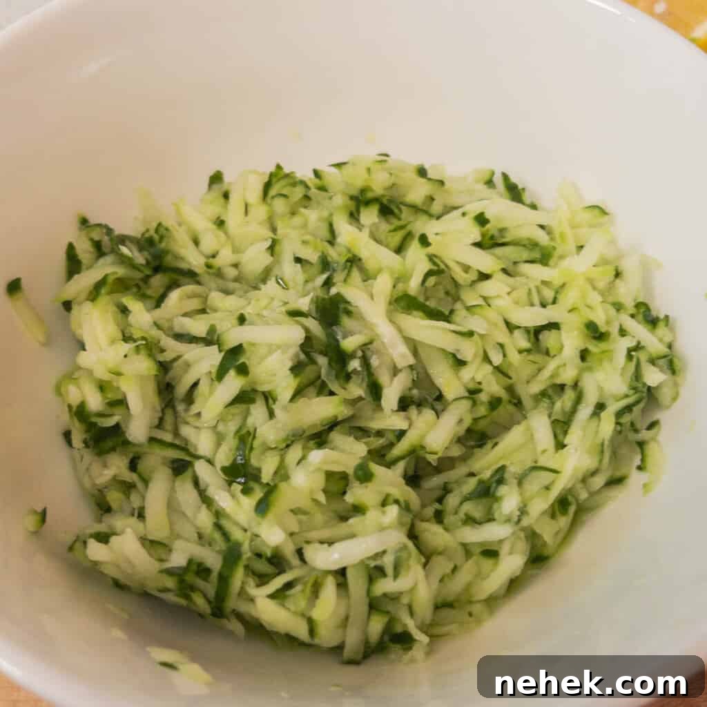 Step 1 Grate the cucumber using a food processor or standard grater