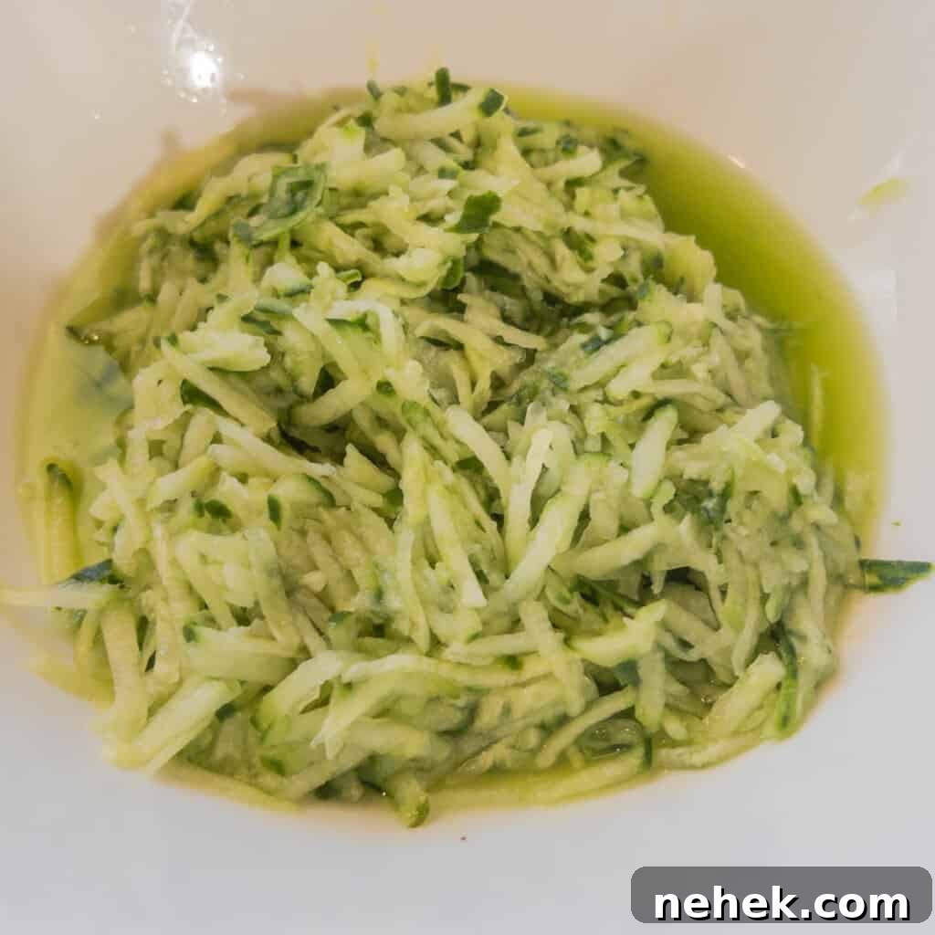 Step 2 Squeeze water out of salted grated cucumber