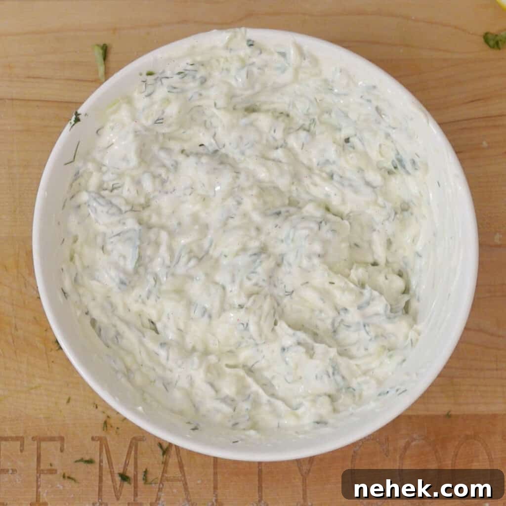 Step 3 - mix yogurt into drained grated cucumbers in a bowl