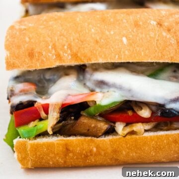 A close up view of a vegetarian mushroom philly cheesesteak sandwich.