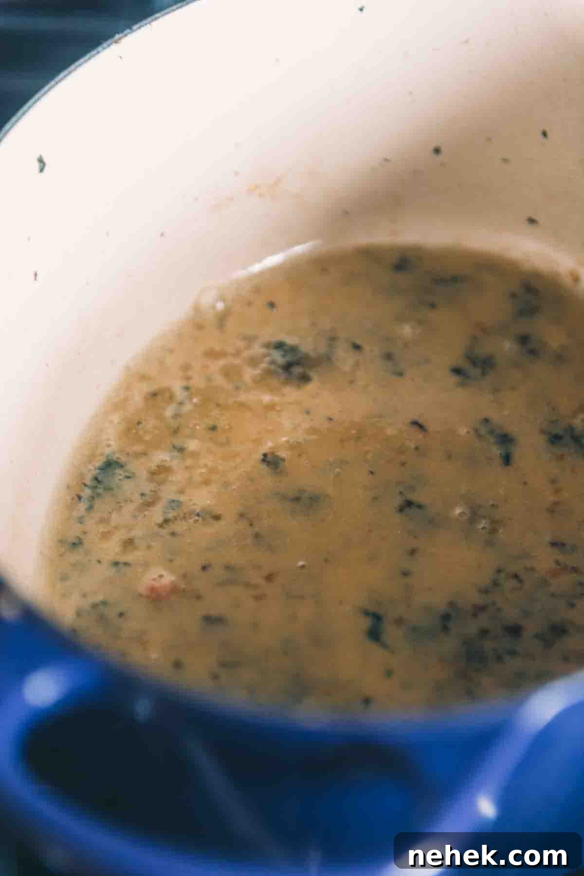 Summering white wine to deglaze the pan.