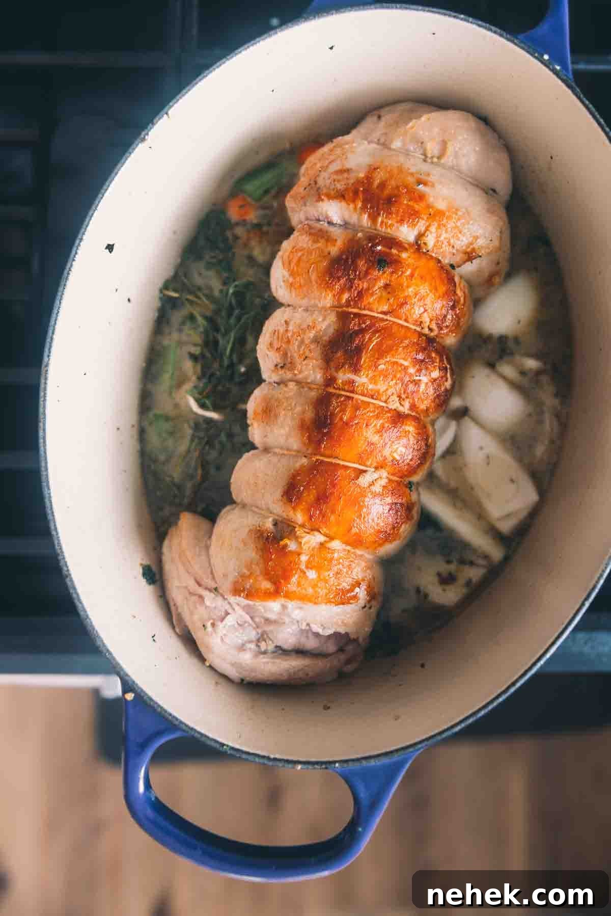 Roast placed in the pot over the vegetables and liquid. 