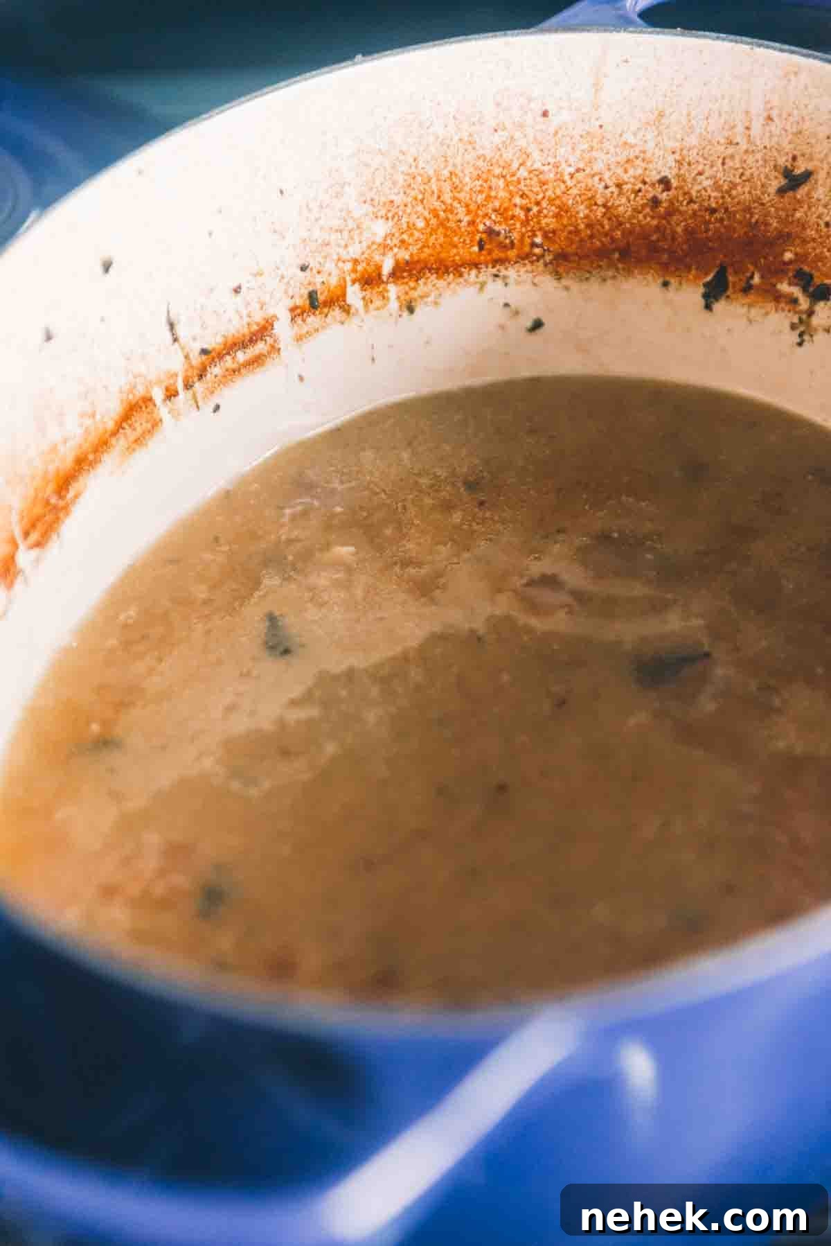 Liquid being reduced in the Dutch oven. 