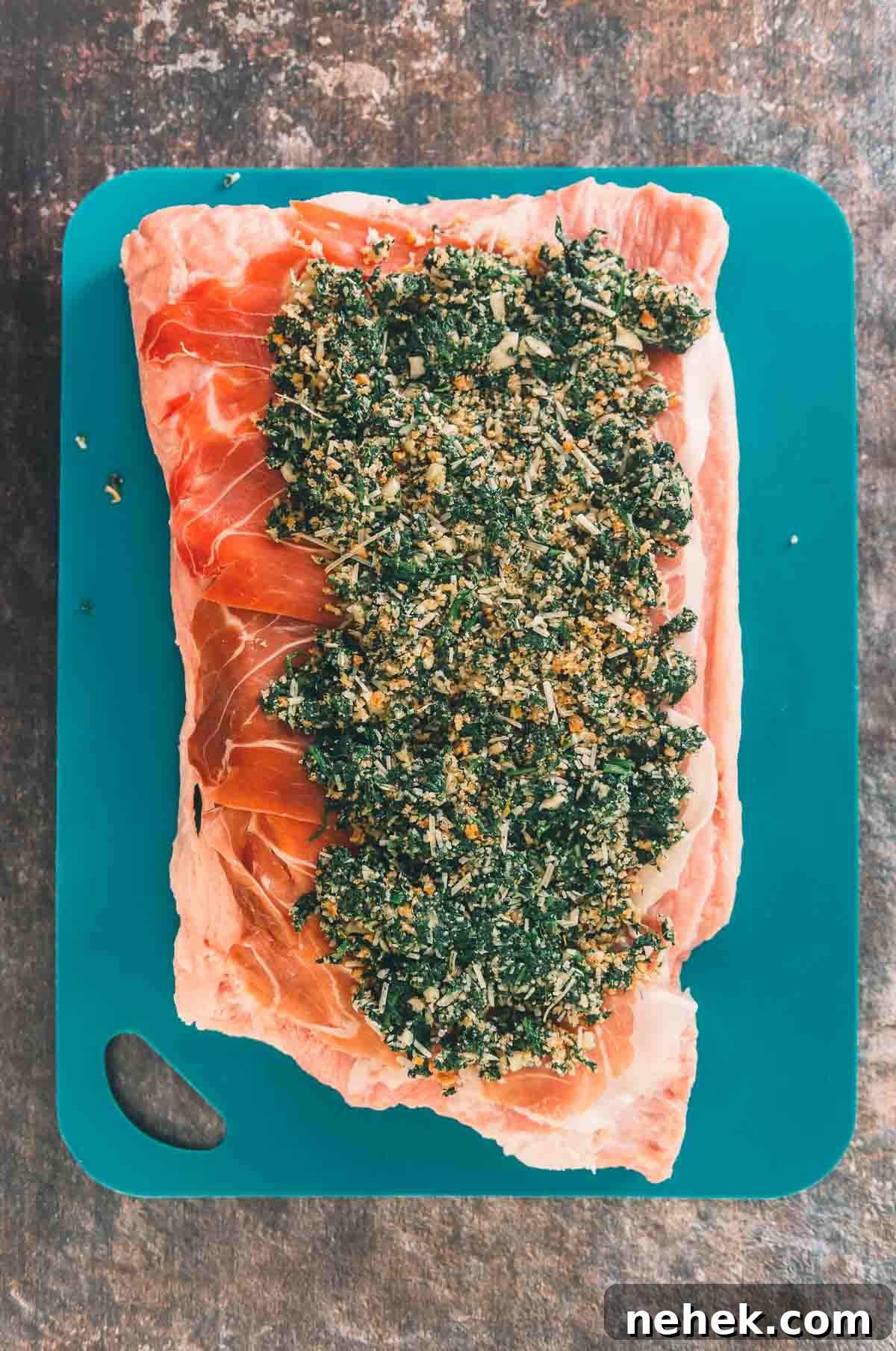 Spinach filling on the meat, leaving a boarder for rolling.