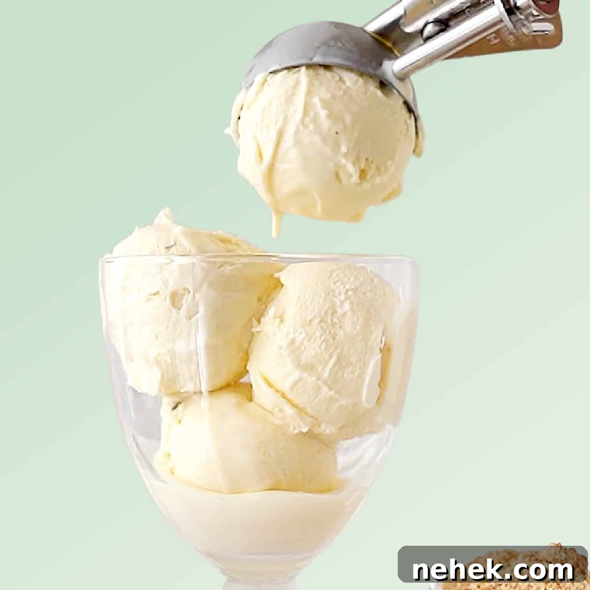 Green background with vanilla ice cream being scooped into a glass. 