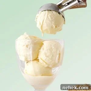 Green background with vanilla ice cream being scooped into a glass.