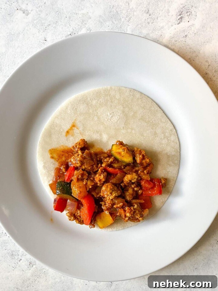 Enchilada mix on tortilla.