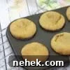 35 High-Protein Vegan Powder Recipes for Smoothies & Snacks 12 Peanut butter protein muffins in a dark grey muffin tray.
