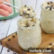 35 High-Protein Vegan Powder Recipes for Smoothies & Snacks 13 Three mason jars filled with cookie dough overnight oats topped with chocolate chips.