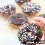 35 High-Protein Vegan Powder Recipes for Smoothies & Snacks 14 A chocolate glazed protein donut with sprinkles.