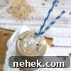 35 High-Protein Vegan Powder Recipes for Smoothies & Snacks 24 Mason jar with coffee protein shake and blue straws.