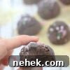 35 High-Protein Vegan Powder Recipes for Smoothies & Snacks 27 Close up of a chocolate protein truffle with a bite taken.