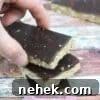 35 High-Protein Vegan Powder Recipes for Smoothies & Snacks 34 Three homemade protein bars with chocolate on top.