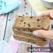 35 High-Protein Vegan Powder Recipes for Smoothies & Snacks 10 Three cookie dough protein bars stacked.