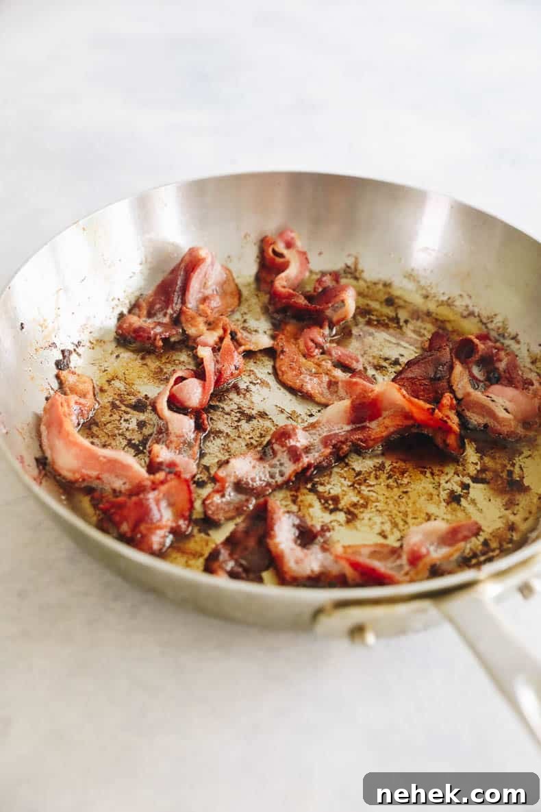 Cooked bacon in a skillet.