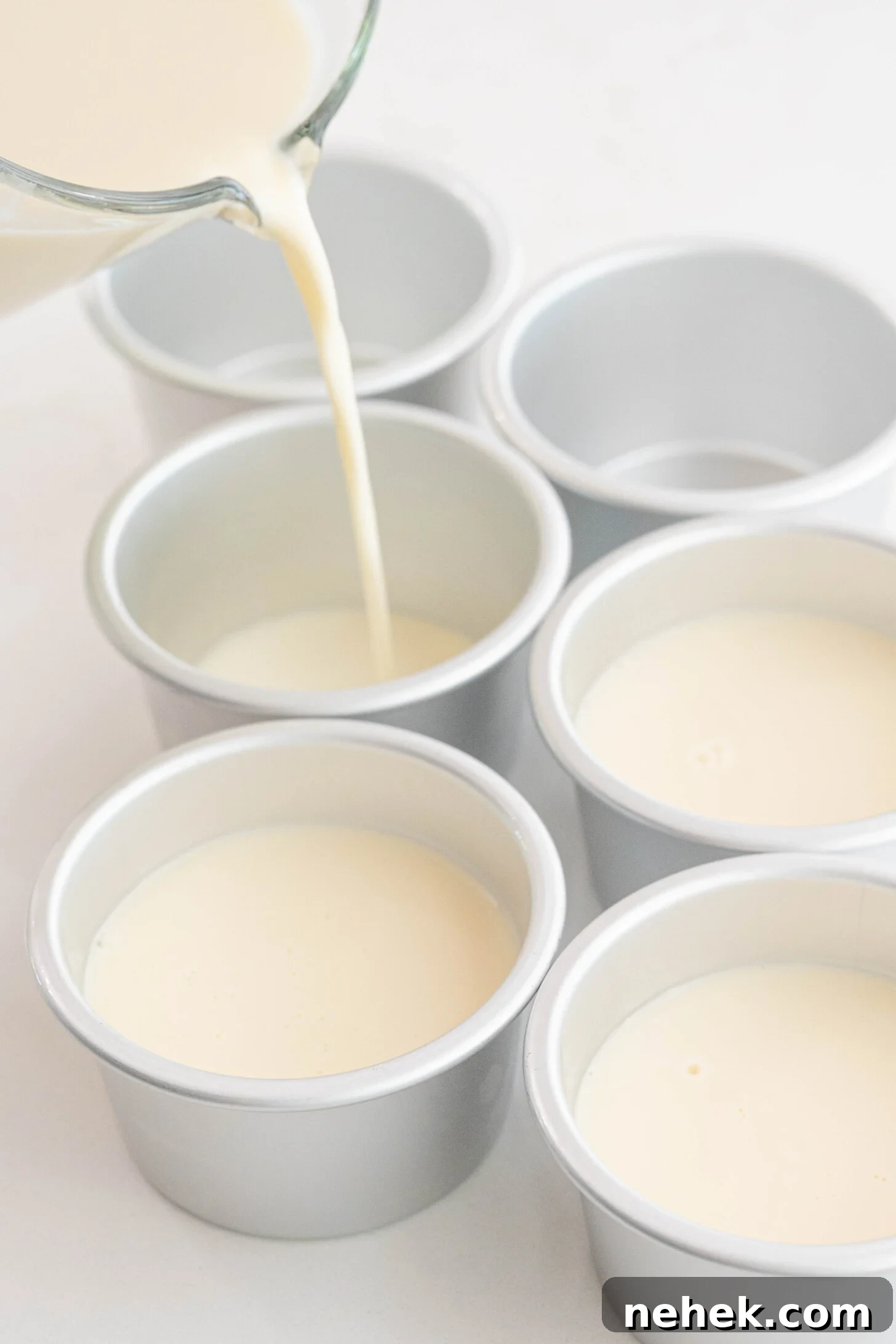 Panna cotta pouring into molds.