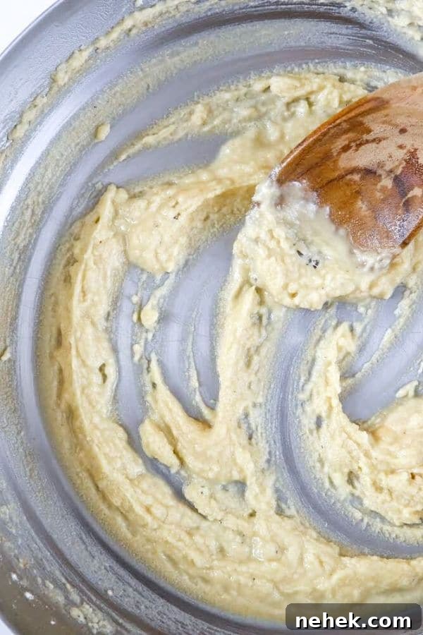 stirring roux in instant pot with wooden spoon