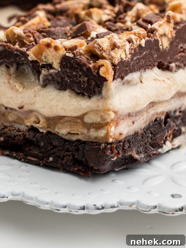 Close up of a snickers brownie from the side.