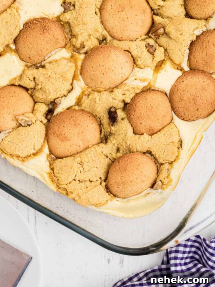 a close up of a finished banana pudding brownies with vanilla wafers on top