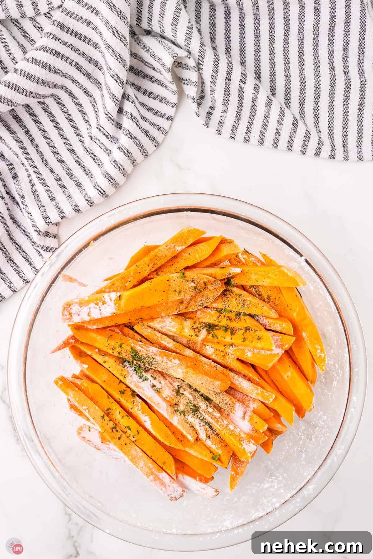Crispy Oven-Baked Sweet Potato Fries Recipe 6 sweet potato sticks with spices on top