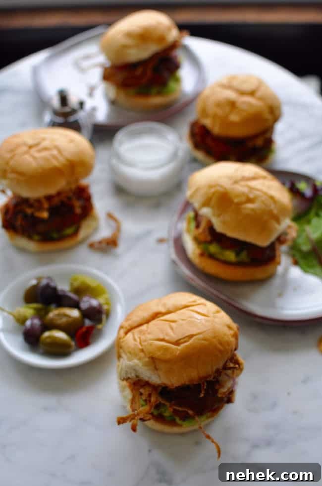 These chorizo burgers are made with Mexican chorizo and ground beef then topped with smashed avocado and a generous pile of crispy fried red onion strings. Chorizo Burgers with crispy onions recipe