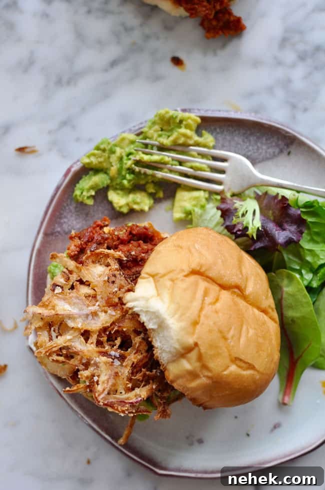 These chorizo burgers are made with Mexican chorizo and ground beef then topped with smashed avocado and a generous pile of crispy fried red onion strings. Chorizo Burgers with Crispy Onions Recipe
