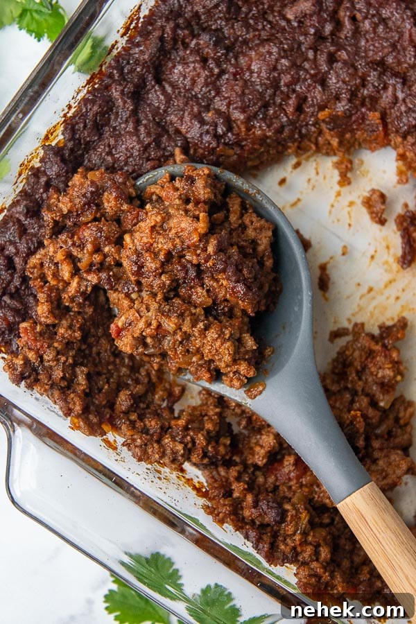 Sweet and Spicy Sloppy Joe Tacos with Lime Sour Cream 3 overhead shot of a spoon scooping up spicy sweet taco meat