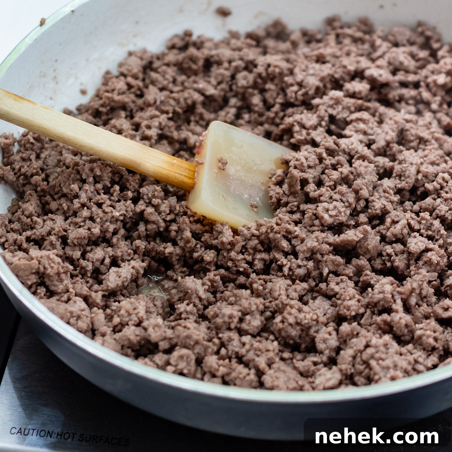 Sweet and Spicy Sloppy Joe Tacos with Lime Sour Cream 4 browned ground beef in a skillet.